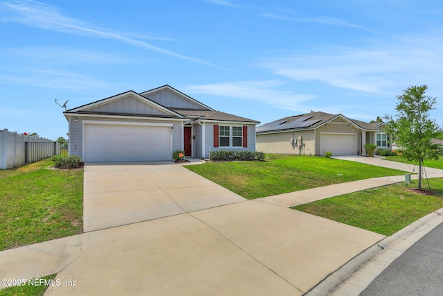 ranch-style home featuring fence, concrete driveway, a garage, a front yard, and board and batten siding