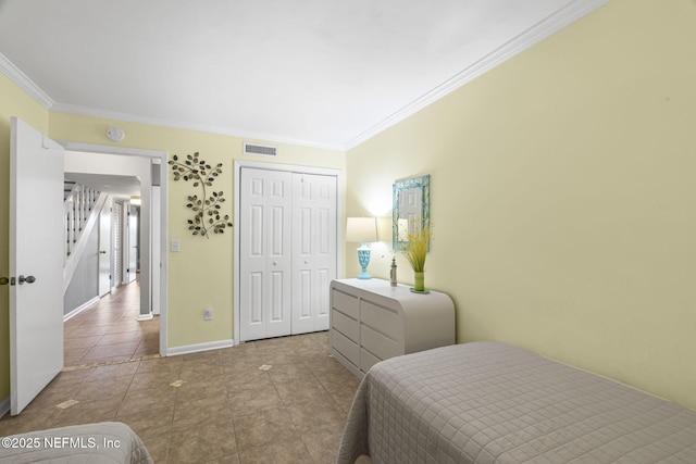 890 A1A Beach Blvd Unit 39, Saint Augustine, FL 32080 - tiled bedroom with ornamental molding and a closet
