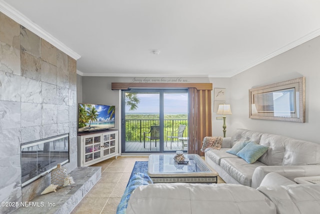 890 A1A Beach Blvd Unit 39, Saint Augustine, FL 32080 - living area with ornamental molding, a tiled fireplace, and tile patterned floors