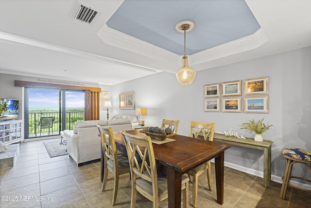 890 A1A Beach Blvd Unit 39, Saint Augustine, FL 32080 - tiled dining space with a raised ceiling and baseboards