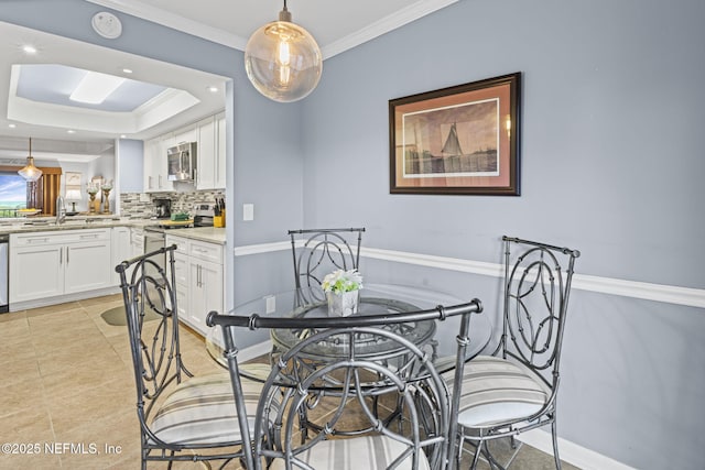 890 A1A Beach Blvd Unit 39, Saint Augustine, FL 32080 - dining space featuring crown molding, recessed lighting, and light tile patterned floors