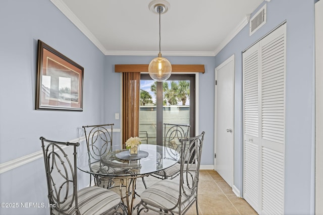 890 A1A Beach Blvd Unit 39, Saint Augustine, FL 32080 - dining room with crown molding and light tile patterned flooring