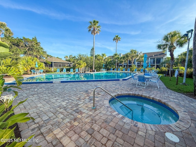 890 A1A Beach Blvd Unit 39, Saint Augustine, FL 32080 - community pool with a hot tub and a patio area
