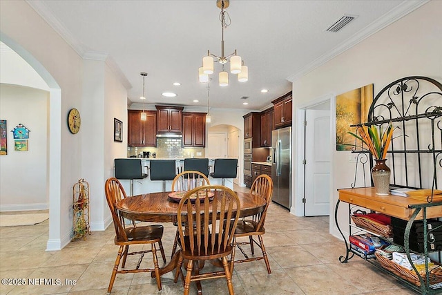 71 Utina Way, Saint Augustine, FL 32084 - dining room with arched walkways, visible vents, an inviting chandelier, and crown molding