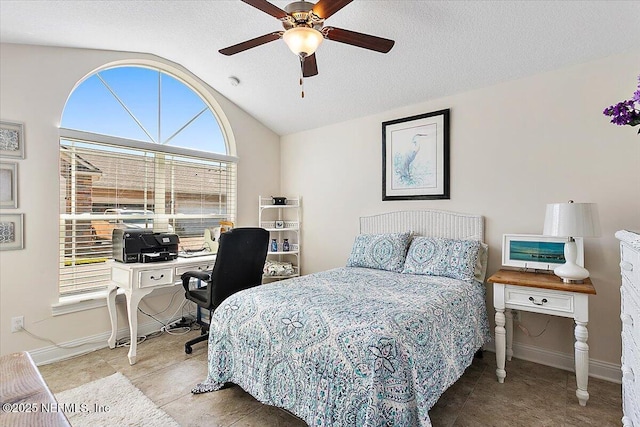71 Utina Way, Saint Augustine, FL 32084 - tiled bedroom featuring baseboards, ceiling fan, a textured ceiling, and vaulted ceiling