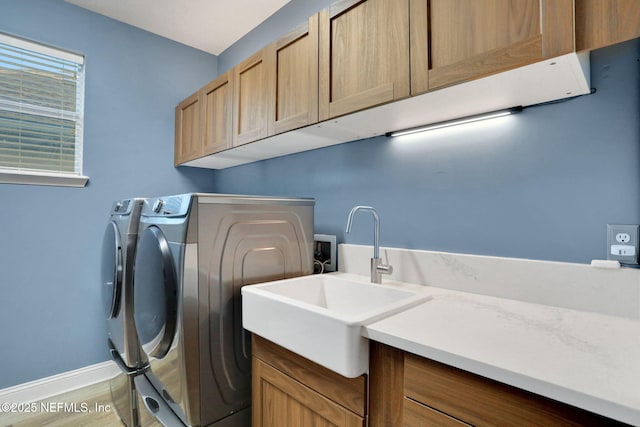 105 Calle Norte, Saint Augustine, FL 32095 - laundry room with cabinet space, separate washer and dryer, baseboards, and wood finished floors