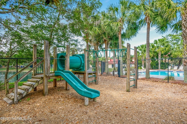 community jungle gym featuring fence