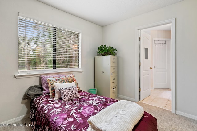 bedroom featuring carpet flooring and baseboards