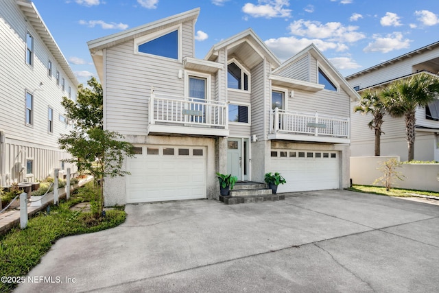 2122 S Fletcher Ave, Fernandina Beach, FL 32034 - townhome / multi-family property with driveway, a garage, and a balcony