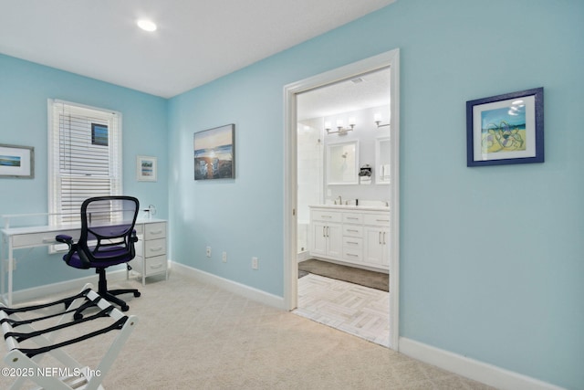 2122 S Fletcher Ave, Fernandina Beach, FL 32034 - home office with carpet flooring, baseboards, and a sink
