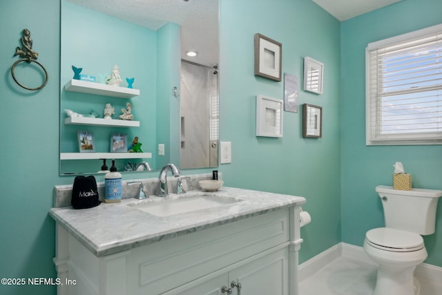 2122 S Fletcher Ave, Fernandina Beach, FL 32034 - bathroom with baseboards, marble finish floor, toilet, vanity, and a shower