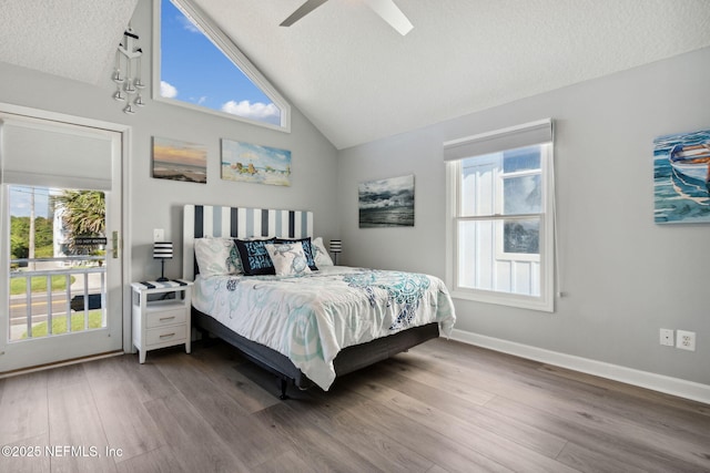 2122 S Fletcher Ave, Fernandina Beach, FL 32034 - bedroom with multiple windows, a textured ceiling, wood finished floors, and a ceiling fan