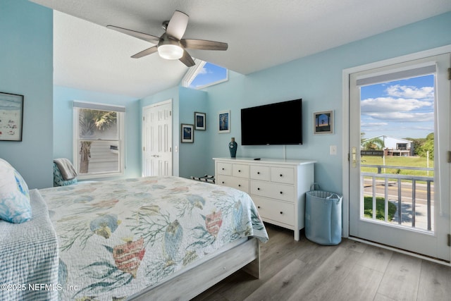 2122 S Fletcher Ave, Fernandina Beach, FL 32034 - bedroom with light wood-style flooring, access to outside, a ceiling fan, and a closet