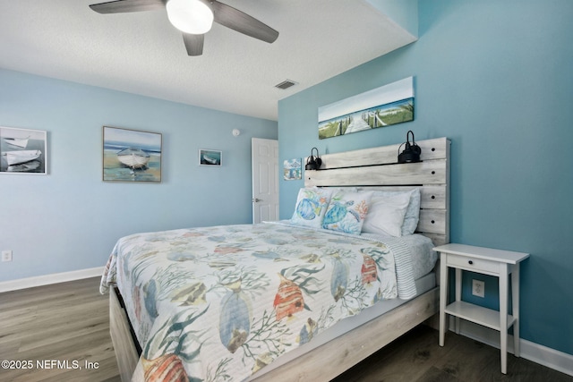 2122 S Fletcher Ave, Fernandina Beach, FL 32034 - bedroom featuring baseboards, a ceiling fan, visible vents, and wood finished floors