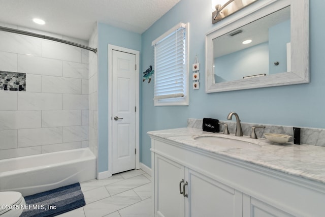 2122 S Fletcher Ave, Fernandina Beach, FL 32034 - full bathroom with toilet, marble finish floor, baseboards, visible vents, and vanity