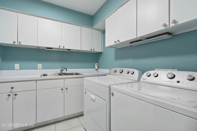 2122 S Fletcher Ave, Fernandina Beach, FL 32034 - laundry room featuring light tile patterned flooring, independent washer and dryer, cabinet space, and a sink