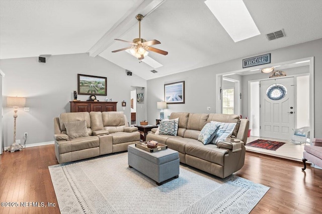 2632 Loopridge Dr, Orange Park, FL 32065 - living area with a skylight, wood-type flooring, a ceiling fan, and baseboards