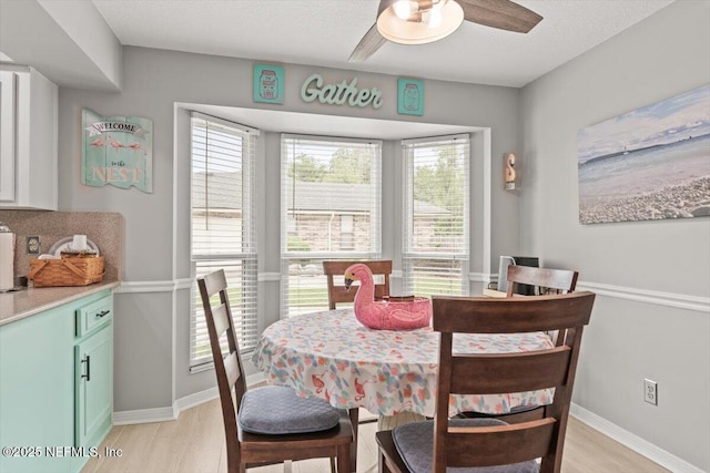 2632 Loopridge Dr, Orange Park, FL 32065 - dining room with a ceiling fan, baseboards, and light wood finished floors