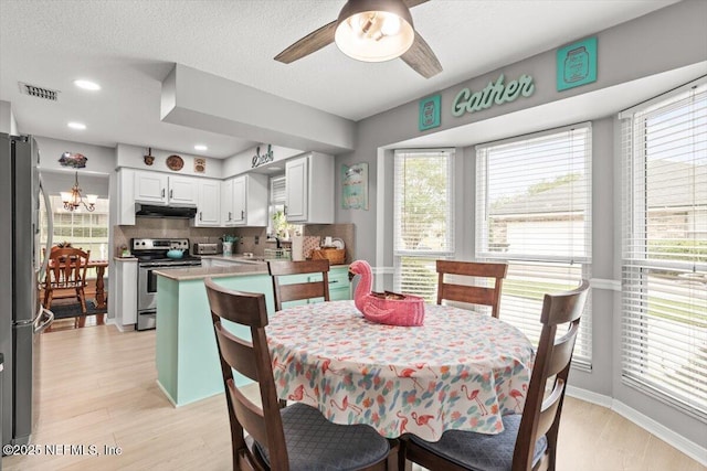 2632 Loopridge Dr, Orange Park, FL 32065 - dining room featuring ceiling fan, plenty of natural light, light wood-style floors, baseboards, and recessed lighting