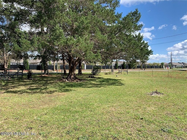 view of yard with fence