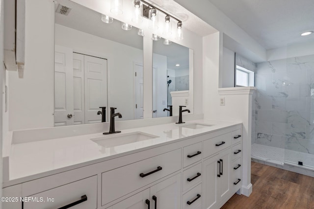 full bath with visible vents, a sink, and a walk in shower