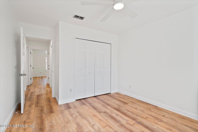 1856 Weston Cir, Fleming Island, FL 32003 - unfurnished bedroom with a closet, light wood-type flooring, visible vents, and baseboards