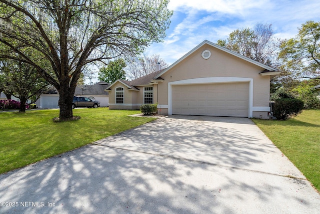ranch-style home featuring a front yard, an attached garage, stucco siding, and driveway