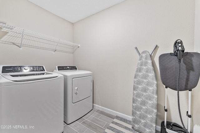 10350 Alder Creek Ln, Jacksonville, FL 32222 - clothes washing area featuring washing machine and dryer and baseboards