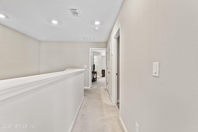 10350 Alder Creek Ln, Jacksonville, FL 32222 - hall with baseboards, recessed lighting, light colored carpet, and an upstairs landing