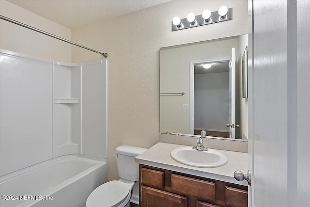 full bath with toilet, shower / bathtub combination, and vanity