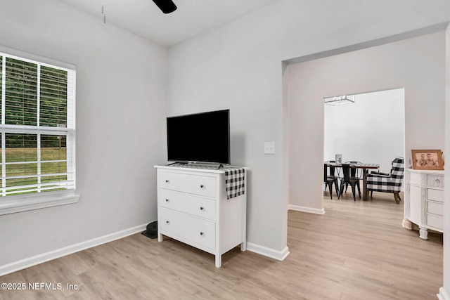 bedroom featuring light wood-style floors and baseboards
