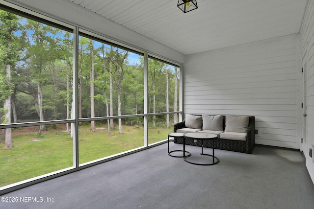 sunroom featuring outdoor lounge area