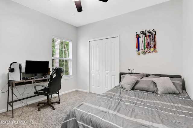 carpeted bedroom with baseboards, a closet, and ceiling fan