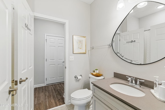 437 Narrowleaf Dr, Saint Johns, FL 32259 - full bath featuring vanity, toilet, baseboards, and wood finished floors