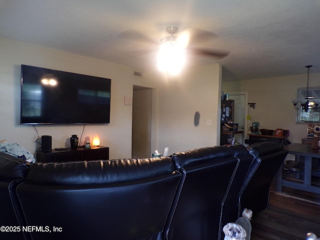 living room with visible vents, ceiling fan, and wood finished floors