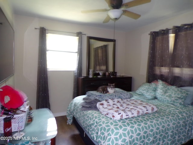 bedroom with wood finished floors and a ceiling fan