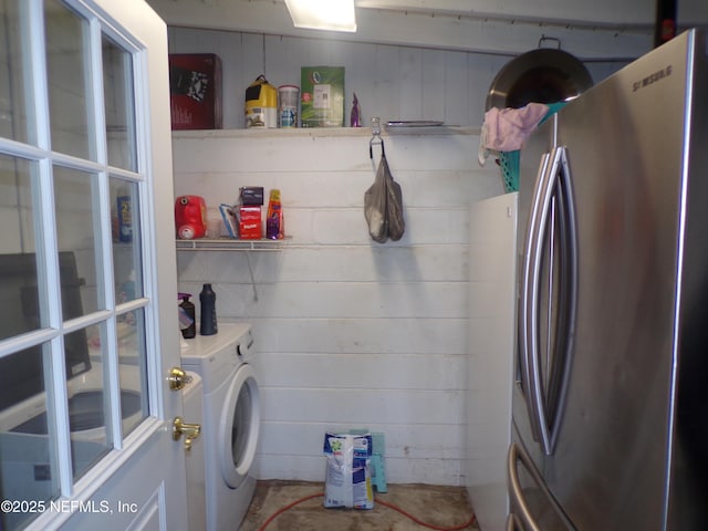 laundry area with laundry area and washer and clothes dryer