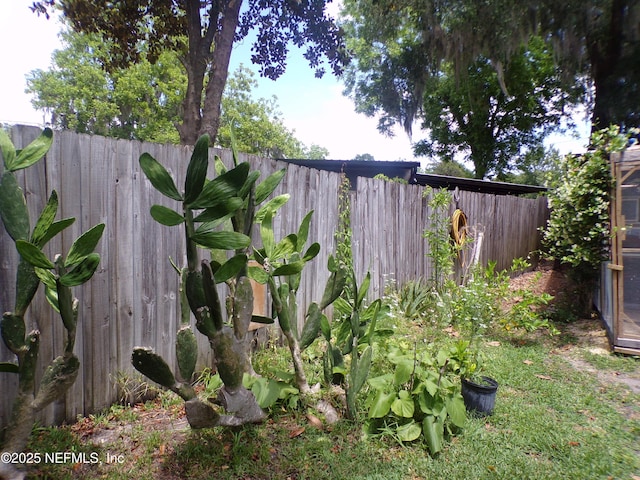 view of yard with a fenced backyard