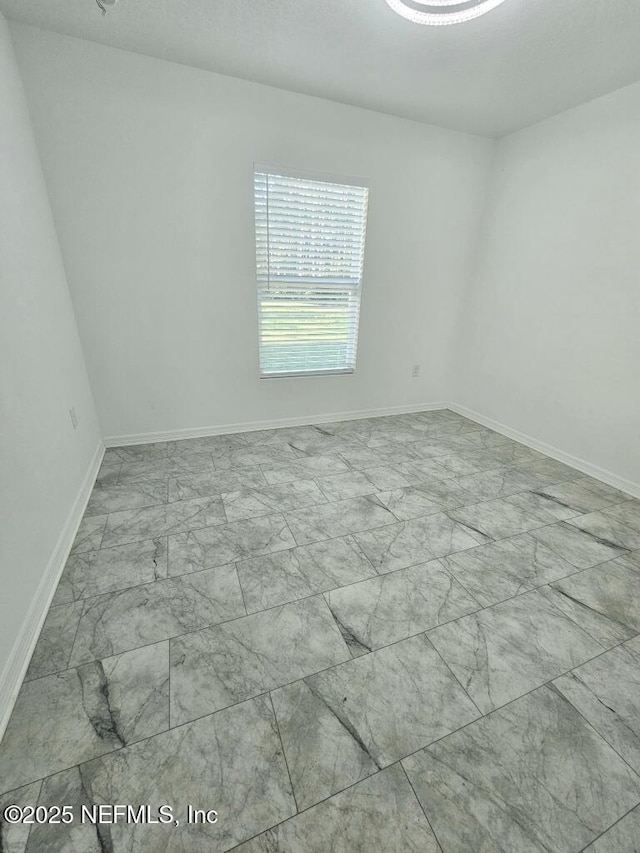 497 Live Oak Loop, Crescent City, FL 32112 - spare room with marble finish floor and baseboards
