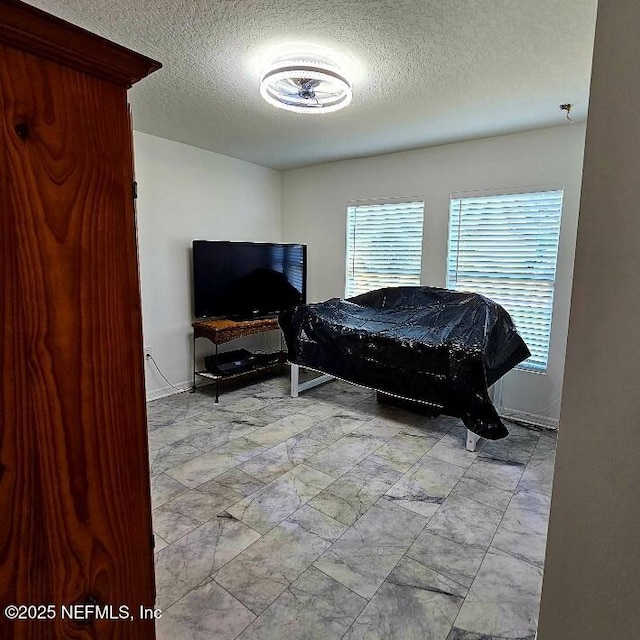 497 Live Oak Loop, Crescent City, FL 32112 - bedroom featuring a textured ceiling and baseboards