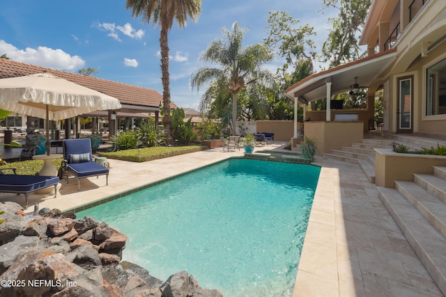 pool featuring a fenced backyard, a patio area, a gazebo, and ceiling fan