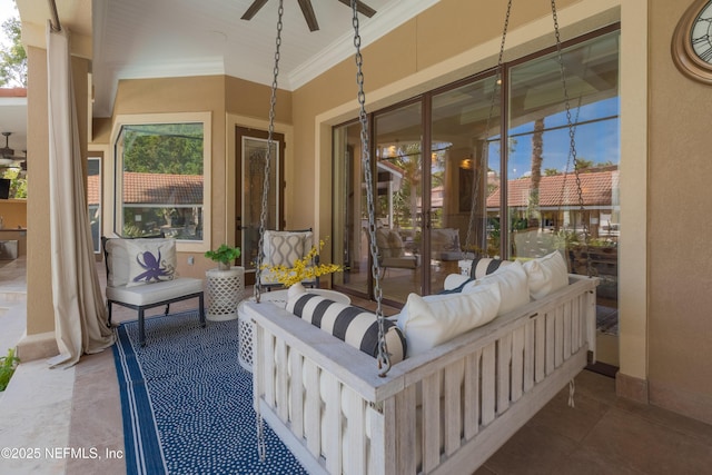 view of patio featuring a ceiling fan and an outdoor living space