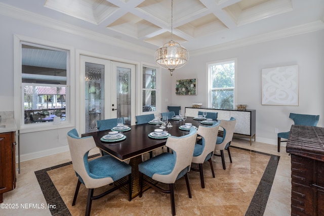 dining space featuring ornamental molding, a chandelier, baseboards, and beamed ceiling