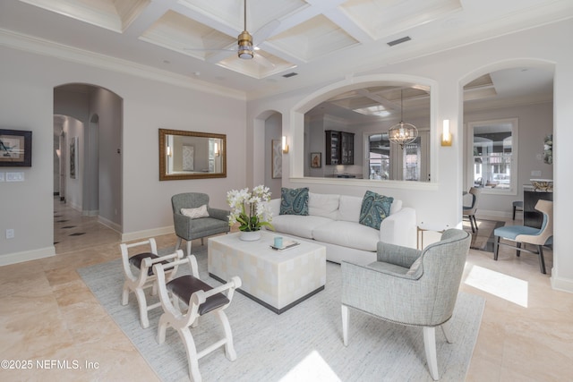 living room featuring beam ceiling, ornamental molding, a ceiling fan, coffered ceiling, and baseboards