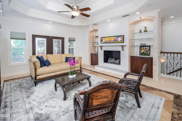 living area with crown molding, a ceiling fan, plenty of natural light, and recessed lighting