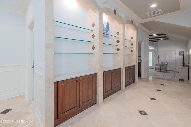 hall with a decorative wall, a wainscoted wall, visible vents, recessed lighting, and crown molding