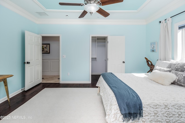 bedroom featuring crown molding, ceiling fan, dark wood-style floors, and visible vents