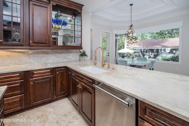 bar featuring stainless steel dishwasher, hanging light fixtures, a sink, backsplash, and a raised ceiling