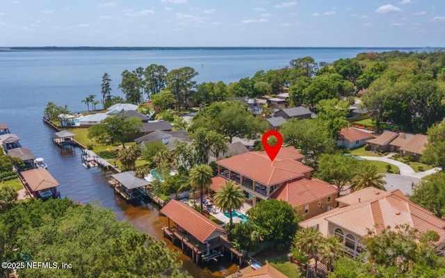bird's eye view featuring a water view and a residential view