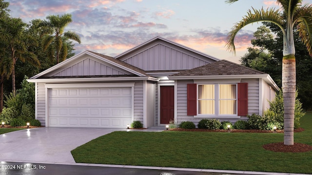 single story home featuring a yard, concrete driveway, an attached garage, and board and batten siding